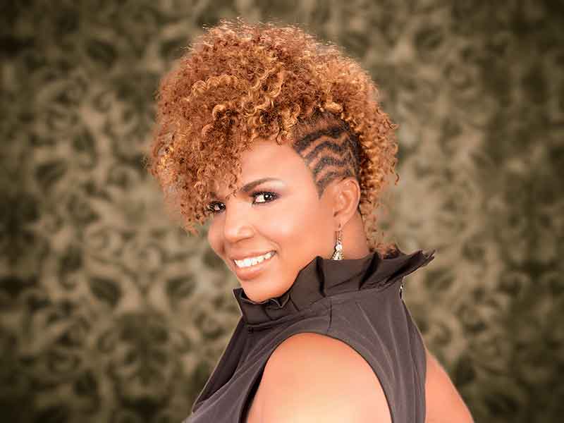 An Impressive Curly Hair Mohawk Hairstyle for Black Women